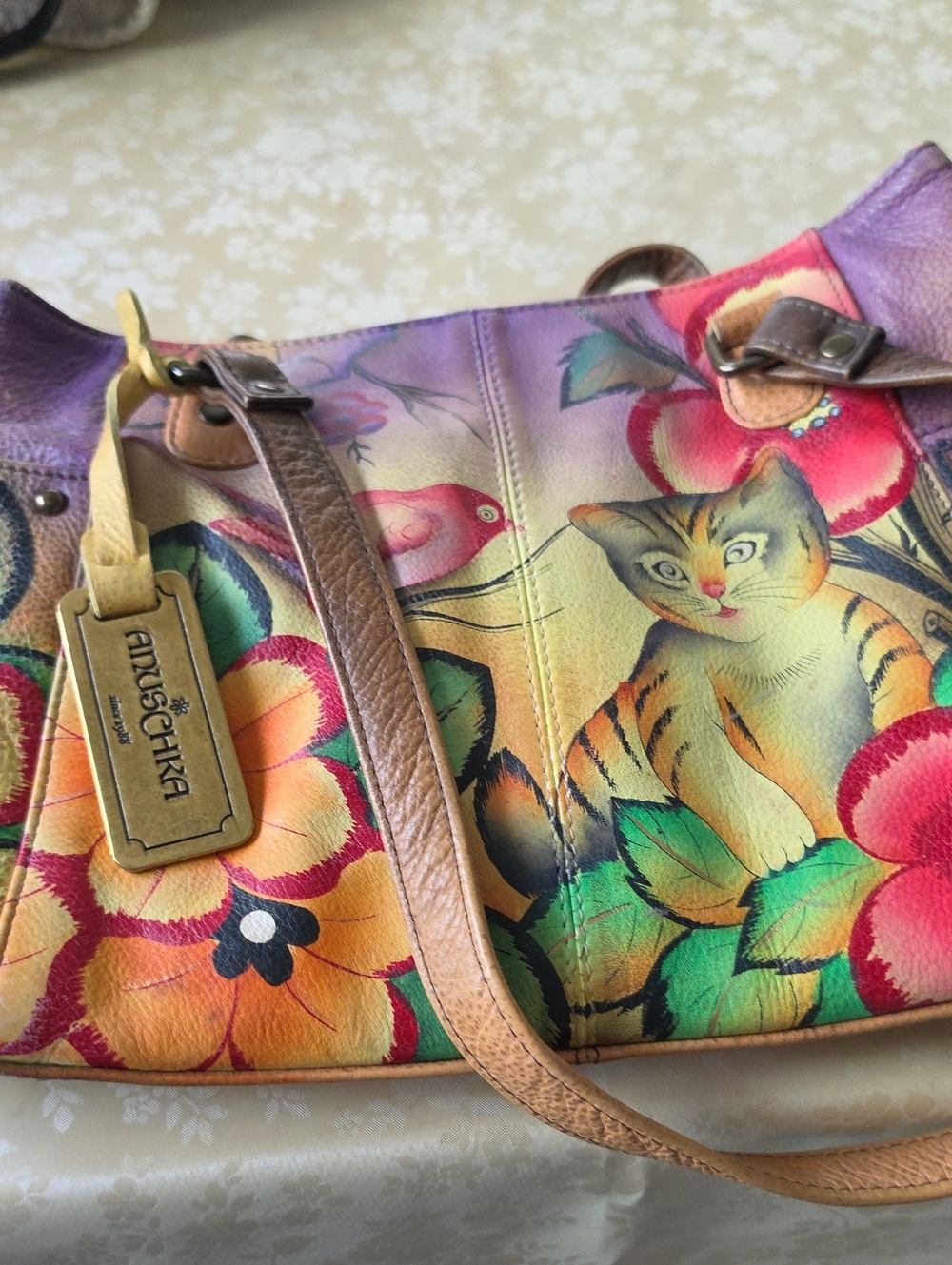 Anuschka Hand-Painted Cat & Floral Leather Shoulder Bag in Multicolor and Brown.
